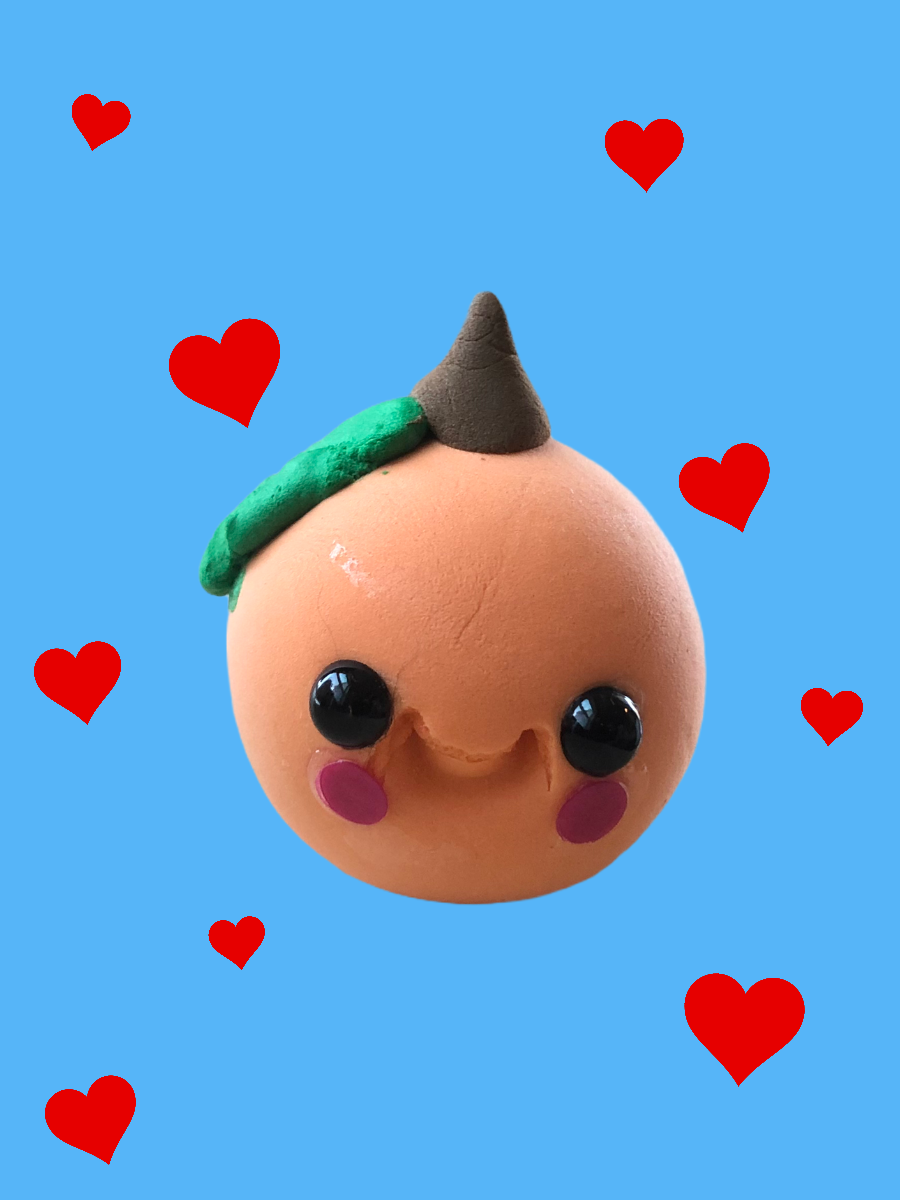 Toy peach made from clay